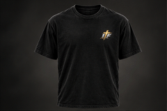 Front of washed black tee with small gold IFR cross logo on left chest