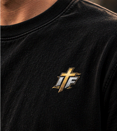 Close-up of gold IFR cross logo on chest of the Clean 660 Tee
