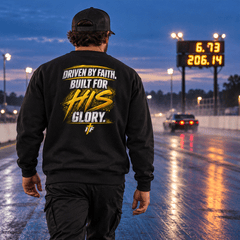 Racer in Faith Crewneck walking the drag strip at blue hour
