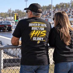 Father in Founding Supporter Tee and daughter watching races from the fence