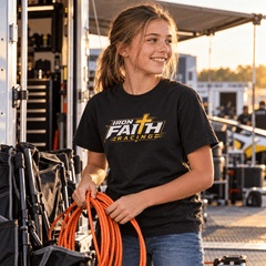 Girl in Iron Faith Racing youth tee coiling a cord in the pits