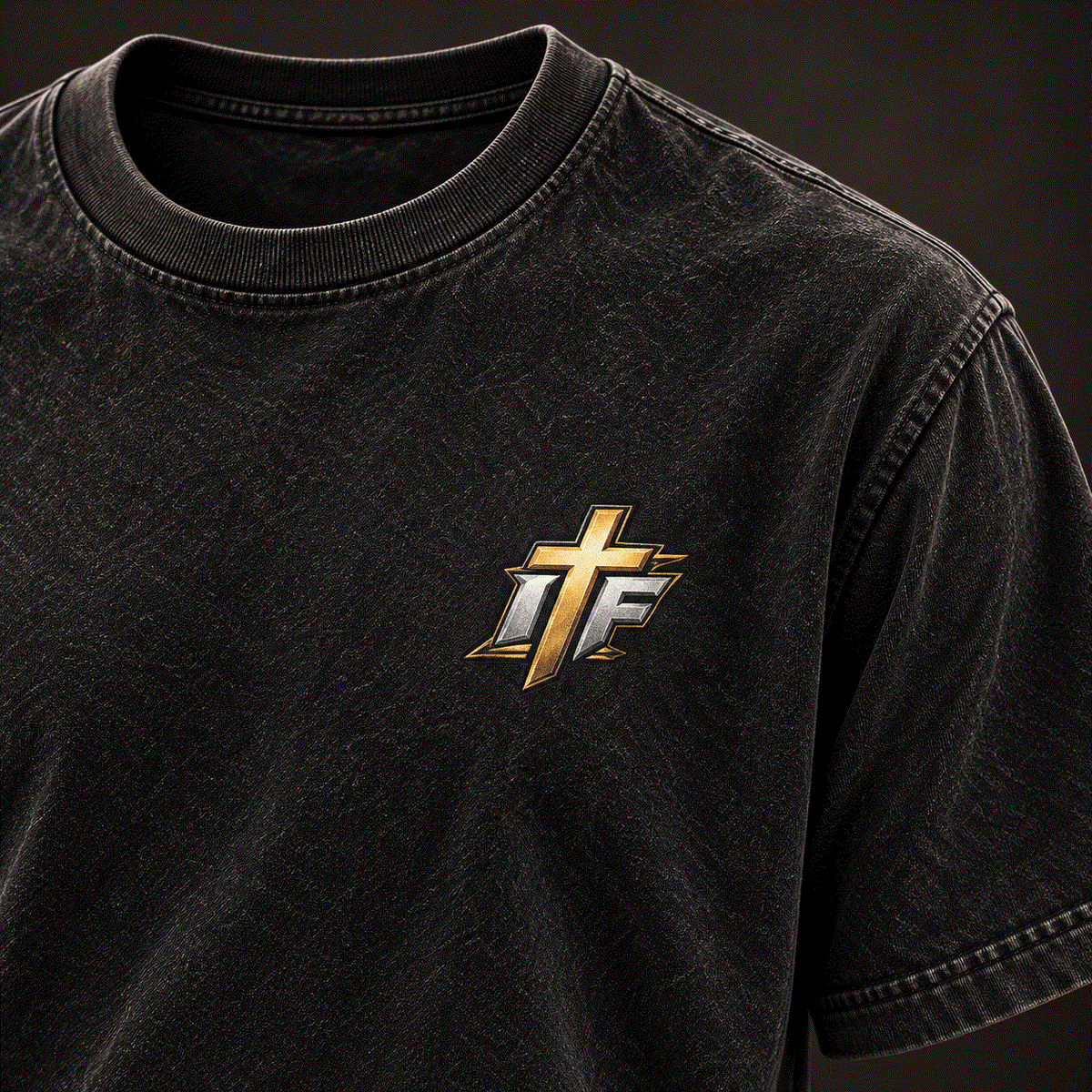 Close-up of gold IFR cross logo on left chest of washed black tee