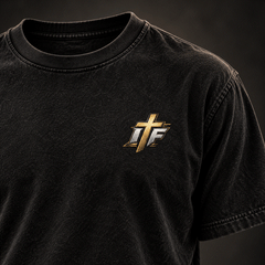Close-up of gold IFR cross logo on chest of the washed black Dial It In Tee