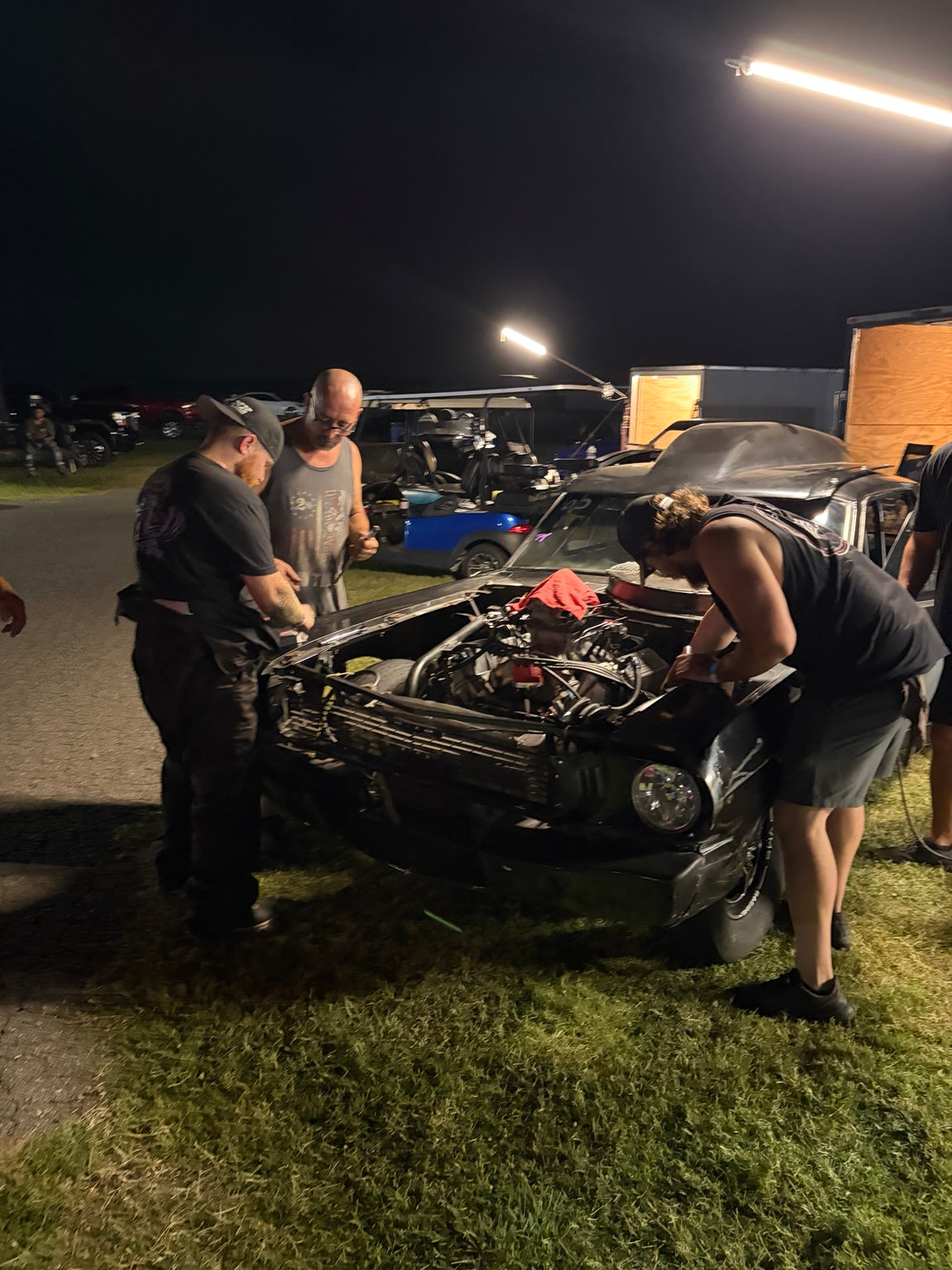The crew working between passes under the lights